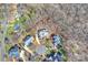 Aerial view of a property with a mature tree line on a wooded lot at 4219 Kronos Pl, Charlotte, NC 28210