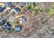 Aerial view of a home and its surrounding land in a leafy neighborhood, bordered by a red outline at 4219 Kronos Pl, Charlotte, NC 28210