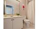 Well-lit bathroom featuring a white vanity, updated fixtures, and a shower with curtain at 4219 Kronos Pl, Charlotte, NC 28210