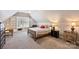 Charming bedroom featuring built-in shelves, cozy decor, and natural light at 4219 Kronos Pl, Charlotte, NC 28210