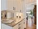 Hallway serving counter has granite countertops, custom cabinets and a mirrored backsplash at 4219 Kronos Pl, Charlotte, NC 28210