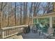 Enjoy outdoor dining on the deck with a grill and wooded view at 4219 Kronos Pl, Charlotte, NC 28210