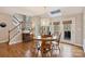 Cozy breakfast nook boasts great natural light, wood floors and a modern chandelier at 4219 Kronos Pl, Charlotte, NC 28210
