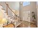 Welcoming foyer with soaring ceilings, elegant staircase, front door, and decorative details at 4219 Kronos Pl, Charlotte, NC 28210