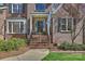 Charming brick home featuring a welcoming front entrance with a columned porch and landscaped garden at 4219 Kronos Pl, Charlotte, NC 28210