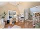 Bright home office featuring a vaulted ceiling, large window, hardwood floors, and a well-organized workspace at 4219 Kronos Pl, Charlotte, NC 28210