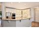 Bright eat-in kitchen with granite countertops, stainless appliances, white cabinets, and decorative backsplash at 4219 Kronos Pl, Charlotte, NC 28210