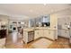 Gourmet kitchen features stainless steel appliances, granite counters, and island with sink and breakfast bar at 4219 Kronos Pl, Charlotte, NC 28210