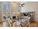 Spacious living room with high ceilings, a fireplace, built-in shelving, and comfortable seating arrangement at 4219 Kronos Pl, Charlotte, NC 28210