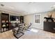 Spacious living room with plush seating, large entertainment unit, and abundant natural light at 4219 Kronos Pl, Charlotte, NC 28210