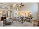 Open-concept living room with high ceilings, comfortable seating, and a view of the upstairs balcony at 4219 Kronos Pl, Charlotte, NC 28210