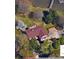 Aerial view of a waterfront home with a red roof, dock, and mature trees at 4220 Honeysuckle Rd, Rock Hill, SC 29732