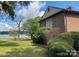 Waterfront property with lush landscaping and mature trees at 4220 Honeysuckle Rd, Rock Hill, SC 29732