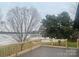 Large deck overlooking a serene lake at 4220 Honeysuckle Rd, Rock Hill, SC 29732