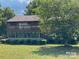 Charming multi-level home with a balcony and well-manicured lawn at 4220 Honeysuckle Rd, Rock Hill, SC 29732