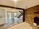 View of foyer with slate tile, staircase, and brick wall at 4220 Honeysuckle Rd, Rock Hill, SC 29732
