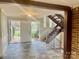 Foyer featuring slate tile, staircase with iron railings, and natural light at 4220 Honeysuckle Rd, Rock Hill, SC 29732