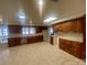 Spacious kitchen with wooden cabinets, tile countertops, and views of the lake at 4220 Honeysuckle Rd, Rock Hill, SC 29732
