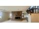 Inviting living room featuring a cozy brick fireplace and a staircase at 4220 Honeysuckle Rd, Rock Hill, SC 29732