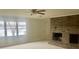 Bright living room featuring a brick fireplace and scenic lake view at 4220 Honeysuckle Rd, Rock Hill, SC 29732