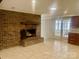 Spacious living room with brick fireplace and tile floors leading to screened patio at 4220 Honeysuckle Rd, Rock Hill, SC 29732