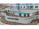 View of community pool, cabana and landscaping with Waterstone sign at 4395 Reed Creek Dr, Sherrills Ford, NC 28673