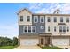 New townhome features a brick and siding facade, attached garages, and well-maintained landscaping at 4407 Reed Creek Dr, Sherrills Ford, NC 28673