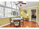 Bright dining area featuring a large window, wood floors, and seating for four at 4607 Carmel Vista Ln, Charlotte, NC 28226