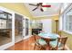 Sunlit dining area with wood floors, casual table and chairs, and access to the living room at 4607 Carmel Vista Ln, Charlotte, NC 28226