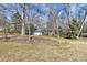 Exterior of the home surrounded by bare trees and foliage, and a well-maintained front lawn at 4607 Carmel Vista Ln, Charlotte, NC 28226
