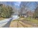 Exterior of the home features a driveway, an attached garage, and a well-maintained front lawn at 4607 Carmel Vista Ln, Charlotte, NC 28226