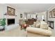 Comfortable living room with a white brick fireplace, plush sofa, and neutral color palette at 4607 Carmel Vista Ln, Charlotte, NC 28226