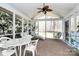 Relaxing screened porch with ceiling fan and comfortable seating overlooking the backyard at 4607 Carmel Vista Ln, Charlotte, NC 28226