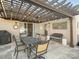 Backyard patio area with a dark pergola, an outdoor table, and an exterior wall at 4631 Dawnridge Dr, Charlotte, NC 28226