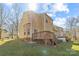Exterior of house featuring yard and wooden deck and stairs at 471 Doughton Ln, Charlotte, NC 28217