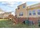 Exterior of house featuring yard and wooden deck and stairs at 471 Doughton Ln, Charlotte, NC 28217