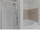 Bathroom featuring glass enclosed shower and a soaking tub at 471 Doughton Ln, Charlotte, NC 28217