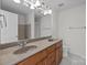 Bathroom featuring dual sinks, large mirror and tiled floors at 471 Doughton Ln, Charlotte, NC 28217