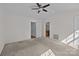 Bedroom showcasing neutral carpet and adjoining bathroom and closet entrances at 471 Doughton Ln, Charlotte, NC 28217