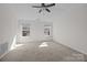 Bright bedroom with neutral carpet, a ceiling fan, and natural light at 471 Doughton Ln, Charlotte, NC 28217