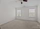 Neutral bedroom boasting natural light, ceiling fan and carpeting at 471 Doughton Ln, Charlotte, NC 28217