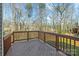Wooden deck overlooking a green backyard with mature trees at 471 Doughton Ln, Charlotte, NC 28217