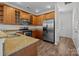 Well-equipped kitchen with stainless steel appliances, granite counters, and ample cabinetry at 471 Doughton Ln, Charlotte, NC 28217