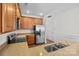 Kitchen featuring stainless steel appliances, wood cabinets, and neutral granite countertops at 471 Doughton Ln, Charlotte, NC 28217