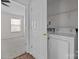 Bright laundry area with white washer and dryer at 471 Doughton Ln, Charlotte, NC 28217