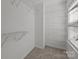 Walk-in closet equipped with ample shelving and storage space at 471 Doughton Ln, Charlotte, NC 28217