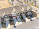 Aerial view of townhomes showcasing the building exteriors, driveways, and nearby street at 5212 Spanish Ivy Ln, Indian Land, SC 29707
