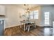 Cozy dining area featuring a modern chandelier and backyard access at 5212 Spanish Ivy Ln, Indian Land, SC 29707
