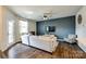 Comfortable living room with a gray accent wall and a ceiling fan at 5212 Spanish Ivy Ln, Indian Land, SC 29707
