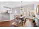 Dining room with hardwood floors, ample natural light, and stylish decor at 6449 Silver Star Ln, Charlotte, NC 28210